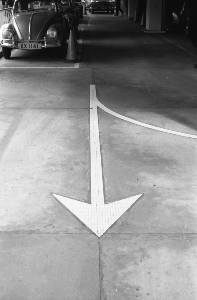 35A-43c Image of an arrow on the floor of a car park in Hong Kong