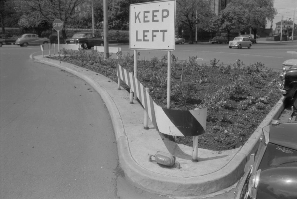 35A-48a Image of a traffic island with a “keep left” sign, corner Spring Street and Little Bourke Street