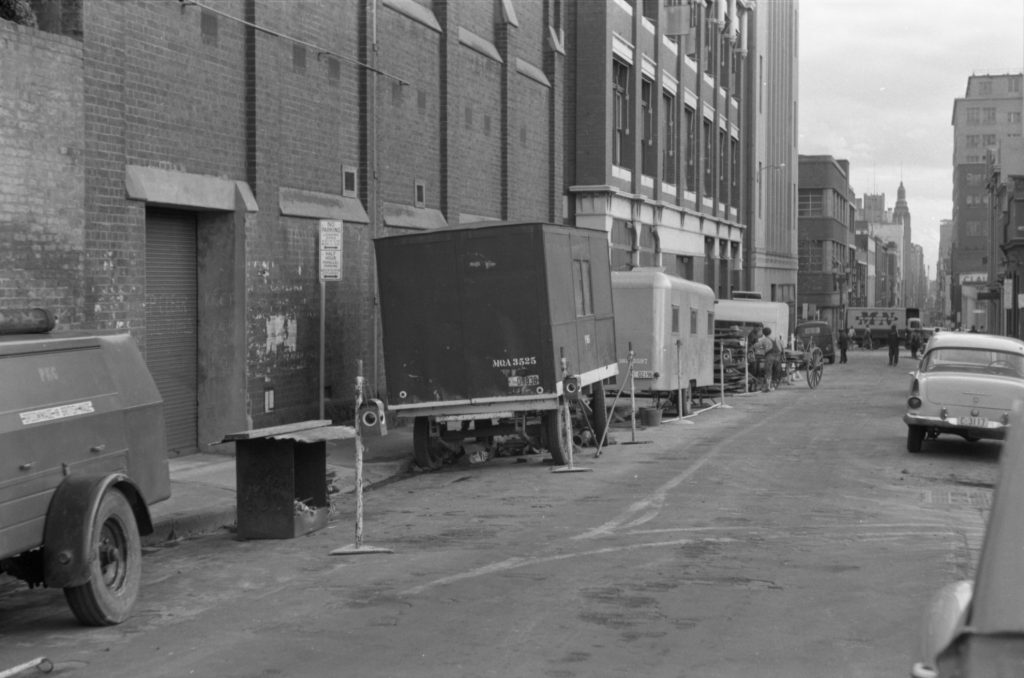 35A-51b Image of parked cars and construction materials, Little Collins Street