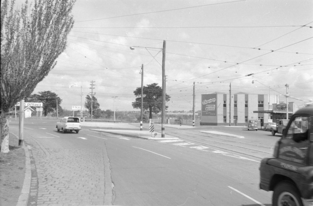 35A-52a Image of a roundabout near Flemington Racecourse, showing tram tracks and a “keep left” sign