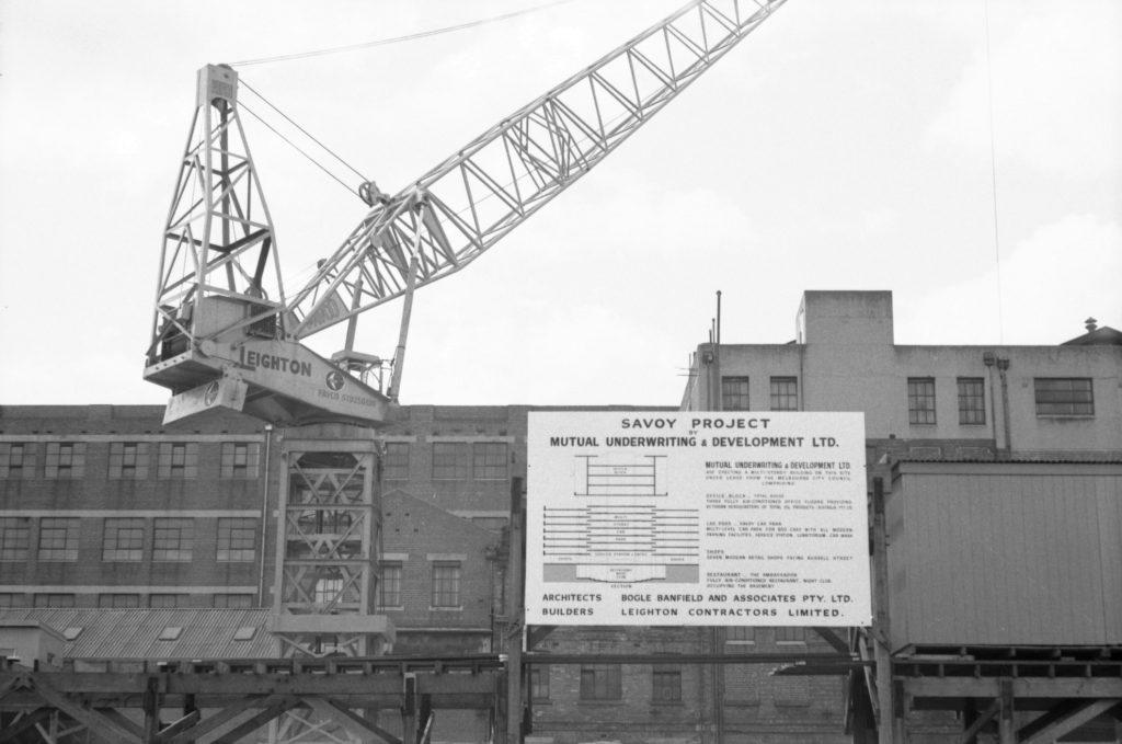 35A-58c Image showing a sign for the Savoy Project, with construction visible behind