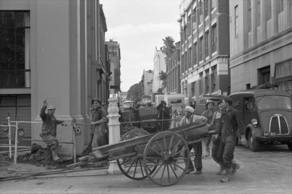 35A-64a Image showing transportation of wood for Postmaster-General works, Little Collins Street facing east from Exhibition Street