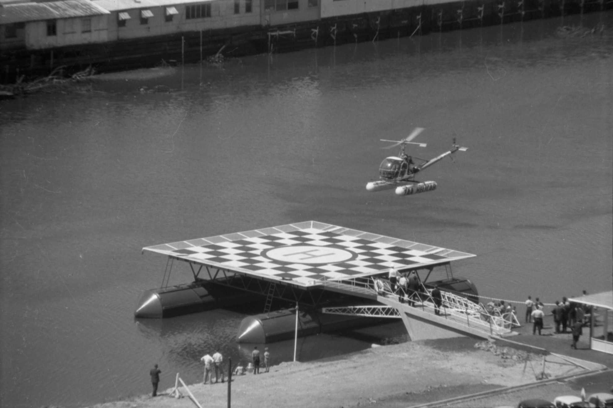 35A79a Image showing a helicopter landing on a helipad City Collection