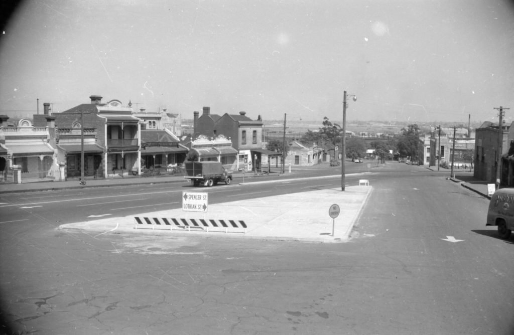 35A-83d Image of a traffic island with a sign for Spencer Street and Lothian Street