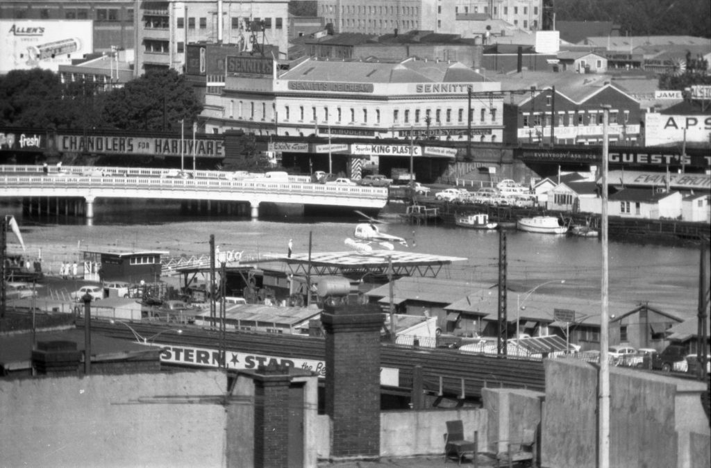 35A-91c Image of a helipad on the Yarra River, with Queens bridge visible behind