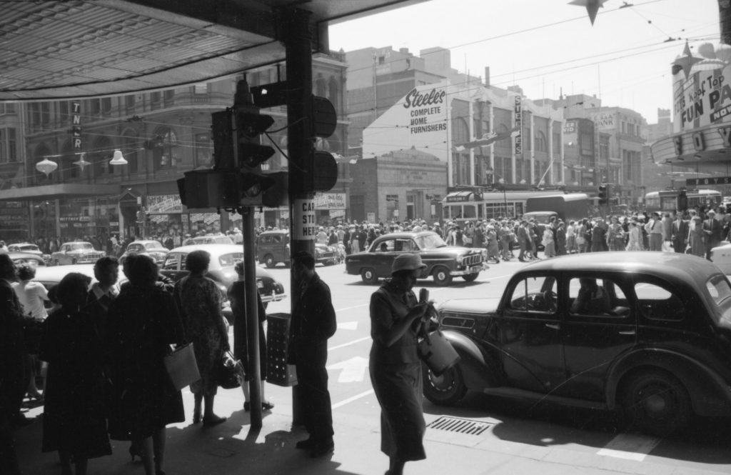 35A-93b Image showing pedestrians, trams and traffic, from the corner of Bourke Street and Swanston Street