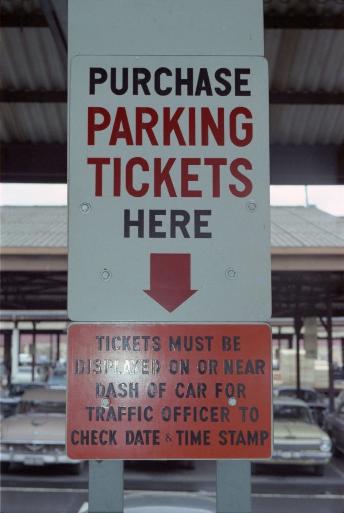 35B-5b Image of a sign for a parking ticket machine