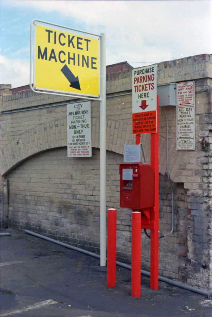 35B-7c Image of a parking ticket machine and signs