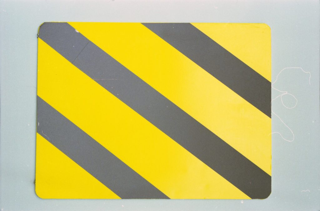 35B-50b Image of a black and yellow striped caution sign