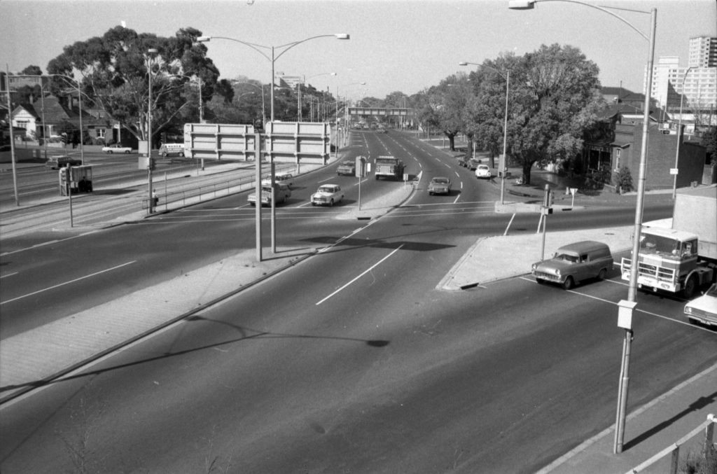 35B-65a Image looking south-east down Flemington Road, showing traffic and tram tracks