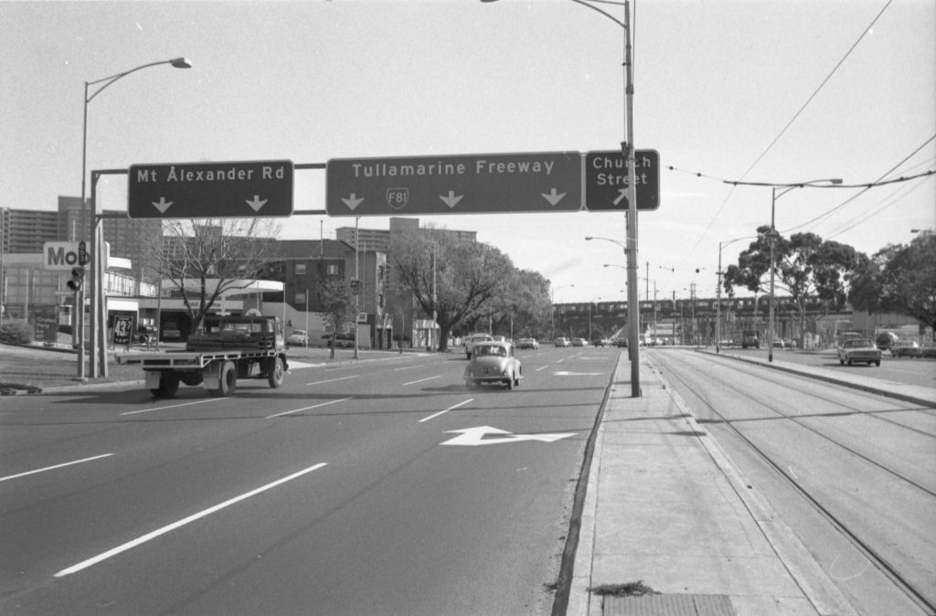 35B-67e Image looking north-west up Flemington Road, showing traffic and tram tracks