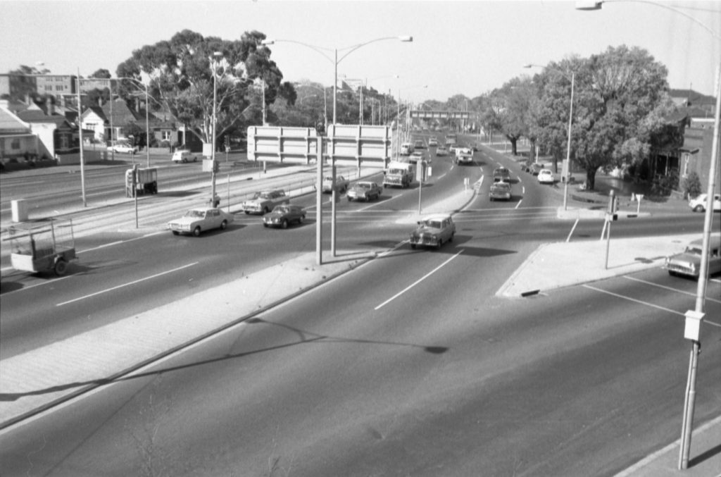 35B-67f Image looking south-east down Flemington Road, showing traffic and tram tracks