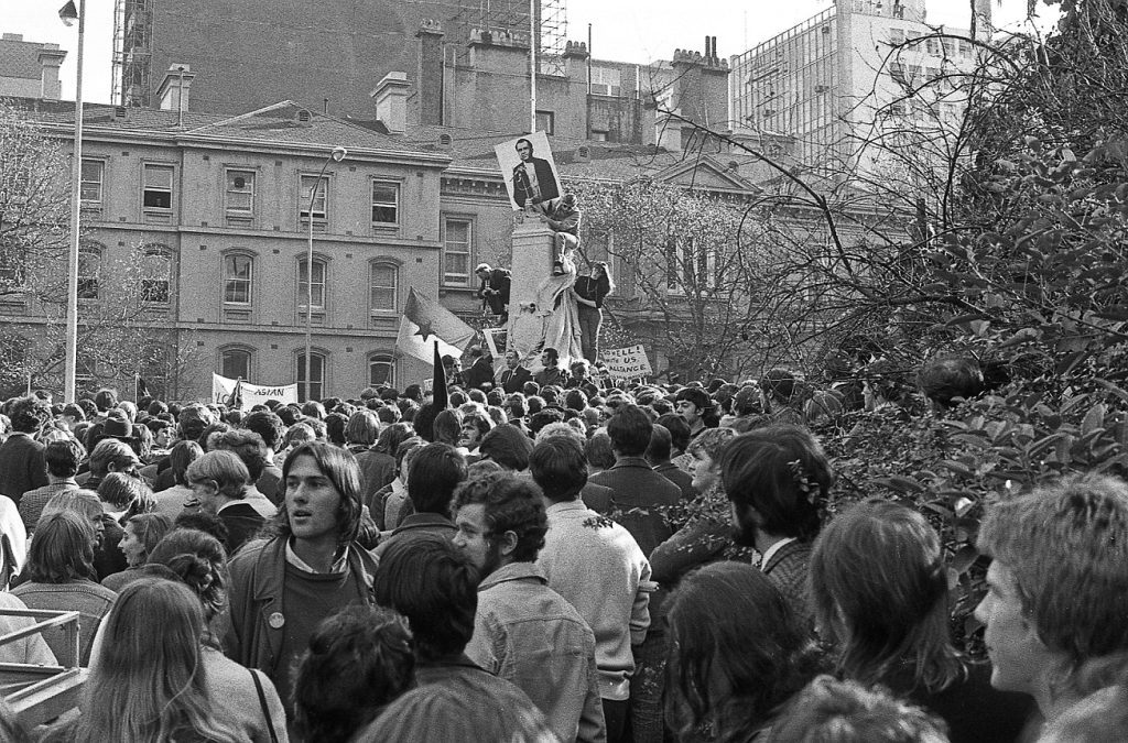 Climbing a statue at Treasury Place (Vietnam moratorium protest)